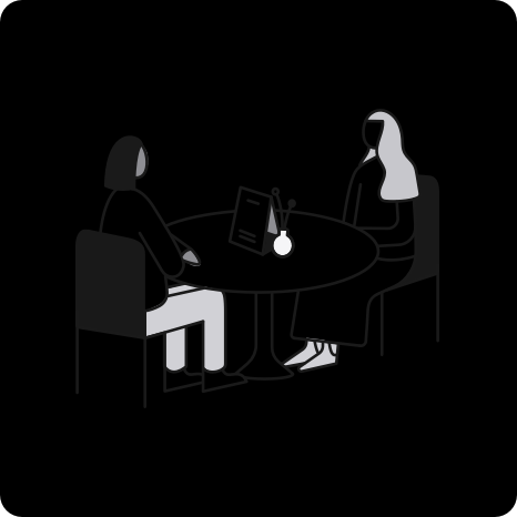 An illustration of two people sitting at a restaurant table done in a simple, abstract style. The illustration has a dark background, and the darker portions of the image are hard to distinguish from the background.