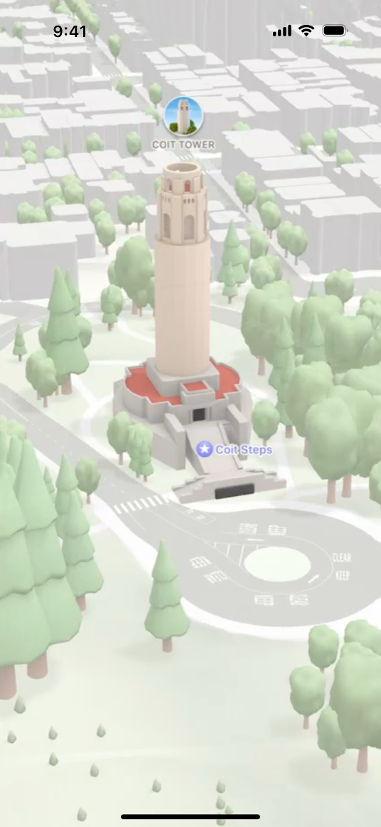 A screenshot of a map on iPhone showing Coit Tower with desaturated colors, representing the muted emphasis style.