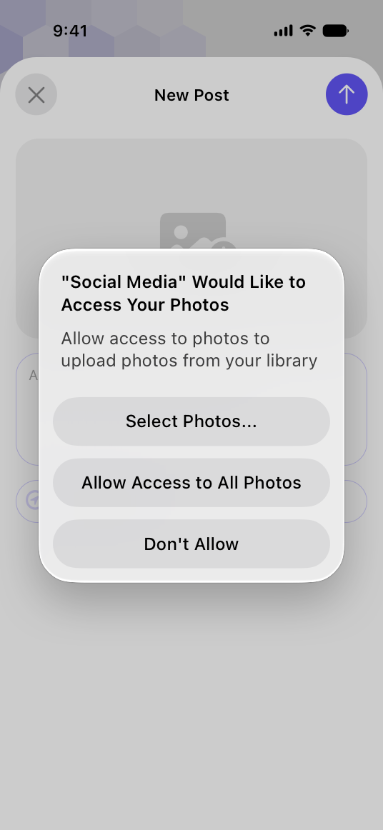 A screenshot of a permission alert for a social media app displaying a purpose string that reads Social Media Would Like to Access Your Photos. Allow access to photos to upload photos from your library. The string is followed by three buttons in a stack. From the top, the buttons are titled Select Photos, Allow Access to All Photos, and Don’t Allow.