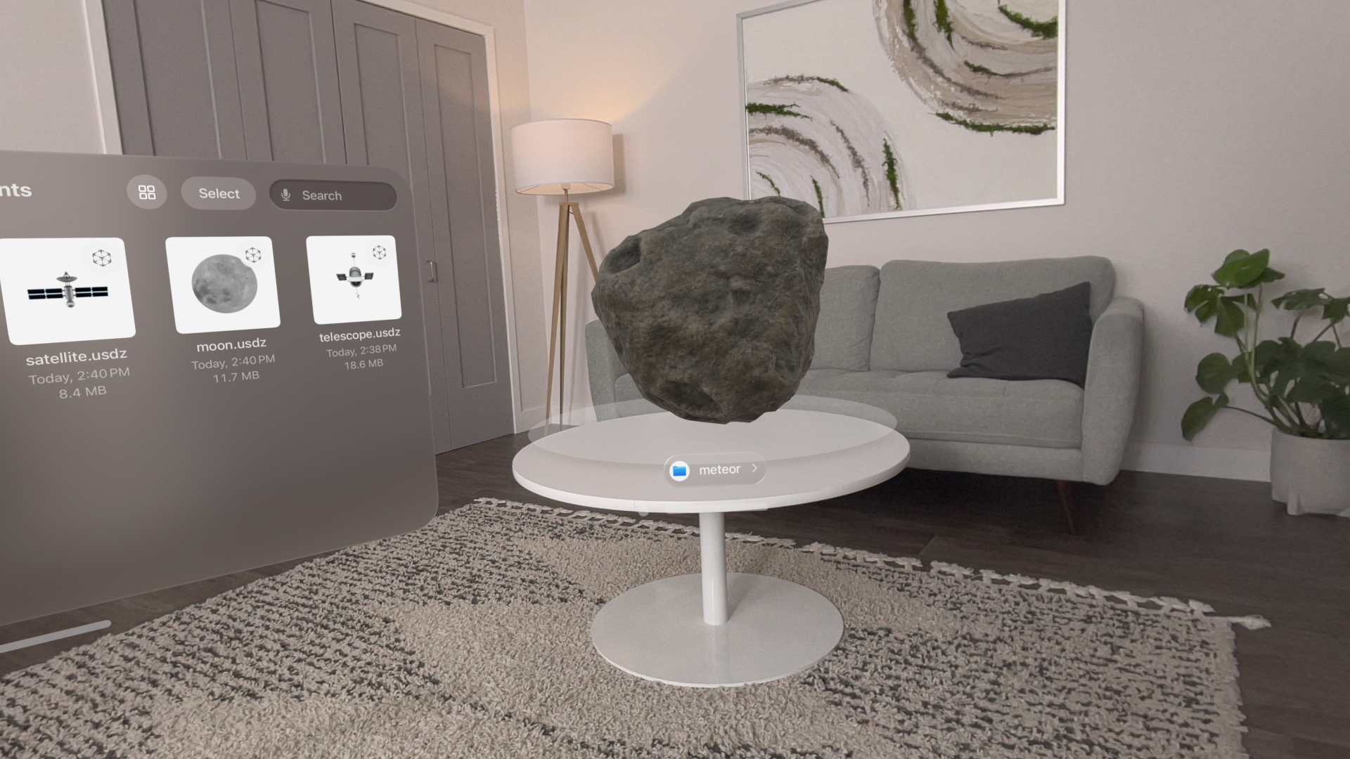 A recording showing a 3D model of a meteor in visionOS rotating above a physical table.