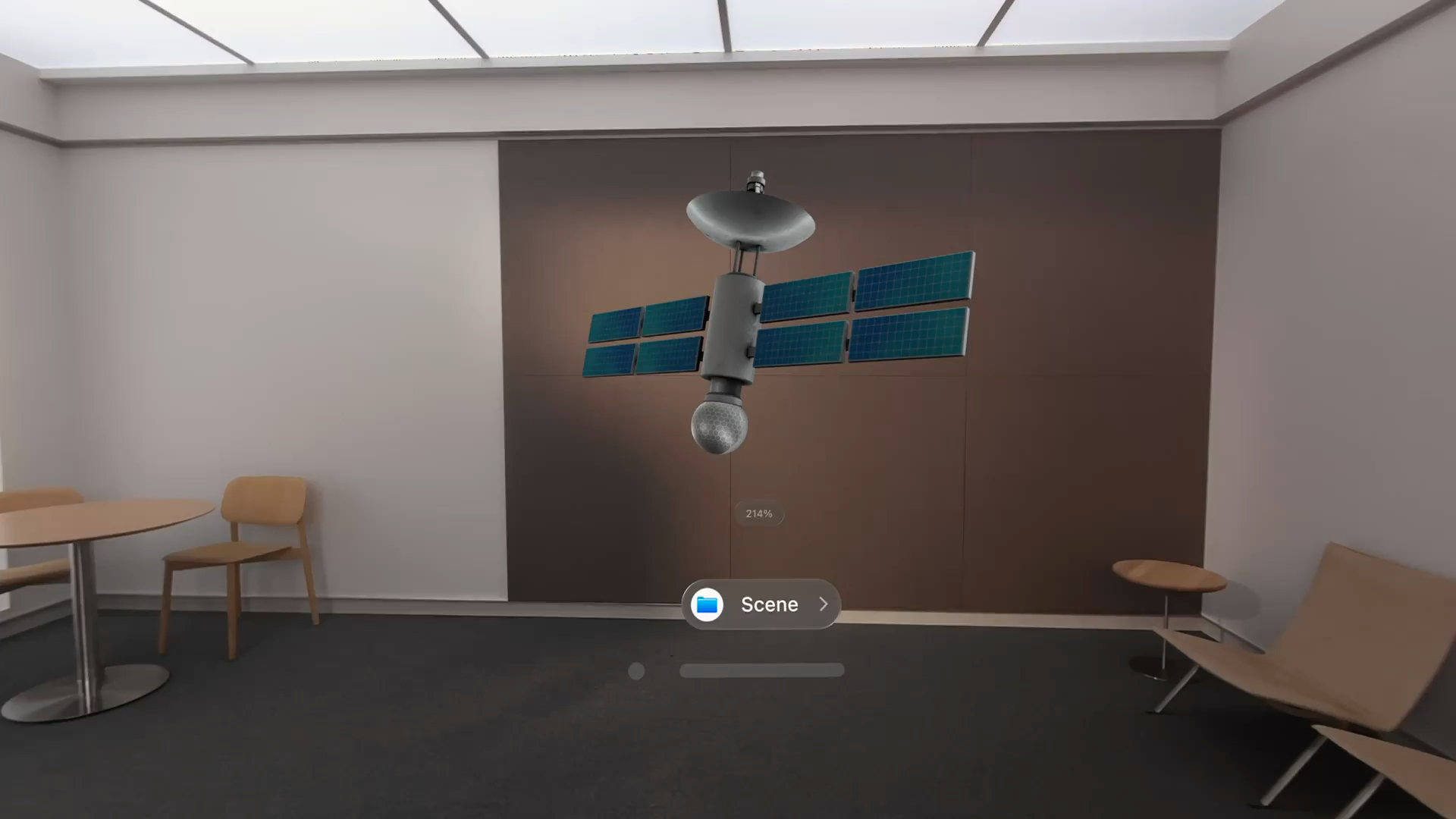 A recording showing a 3D model of a satellite within a visionOS volume. As the viewer approaches the satellite and manipulates its orientation, light reflections adjust based on the position of the viewer and angle of the satellite.
