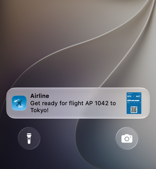 A screenshot of the bottom portion of the Lock Screen on iPhone showing an airline boarding pass banner that reads 'Get ready for flight AP 1042 to Tokyo!', with the pass icon appearing in the leading edge of the banner.
