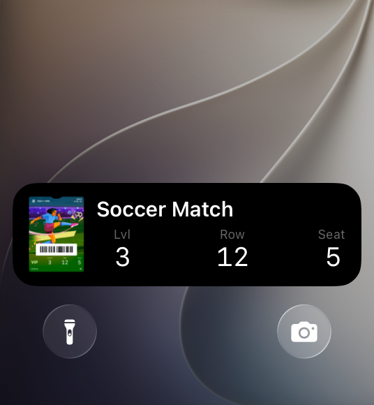 A screenshot of the bottom portion of the Lock Screen on iPhone showing a Live Activity for a soccer event ticket, displaying the seat location at level 3, row 12, seat 5.